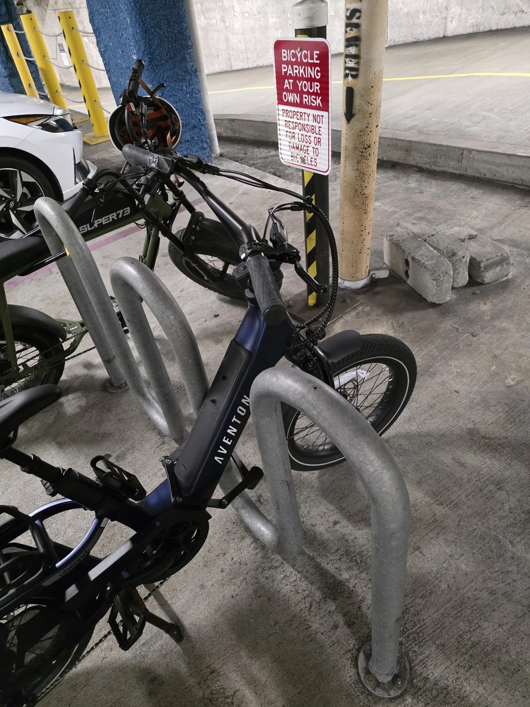 My Aventon Abound SR e-bike parked at a bicycle rack