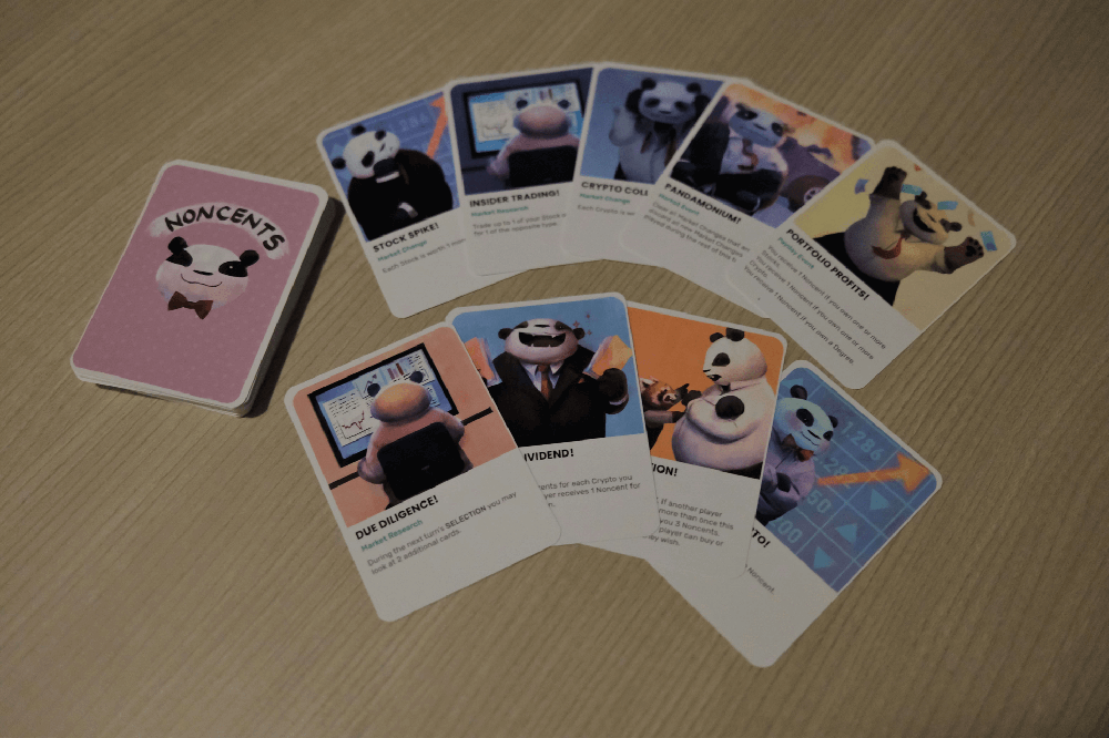 Noncents event deck cards fanned out on a table